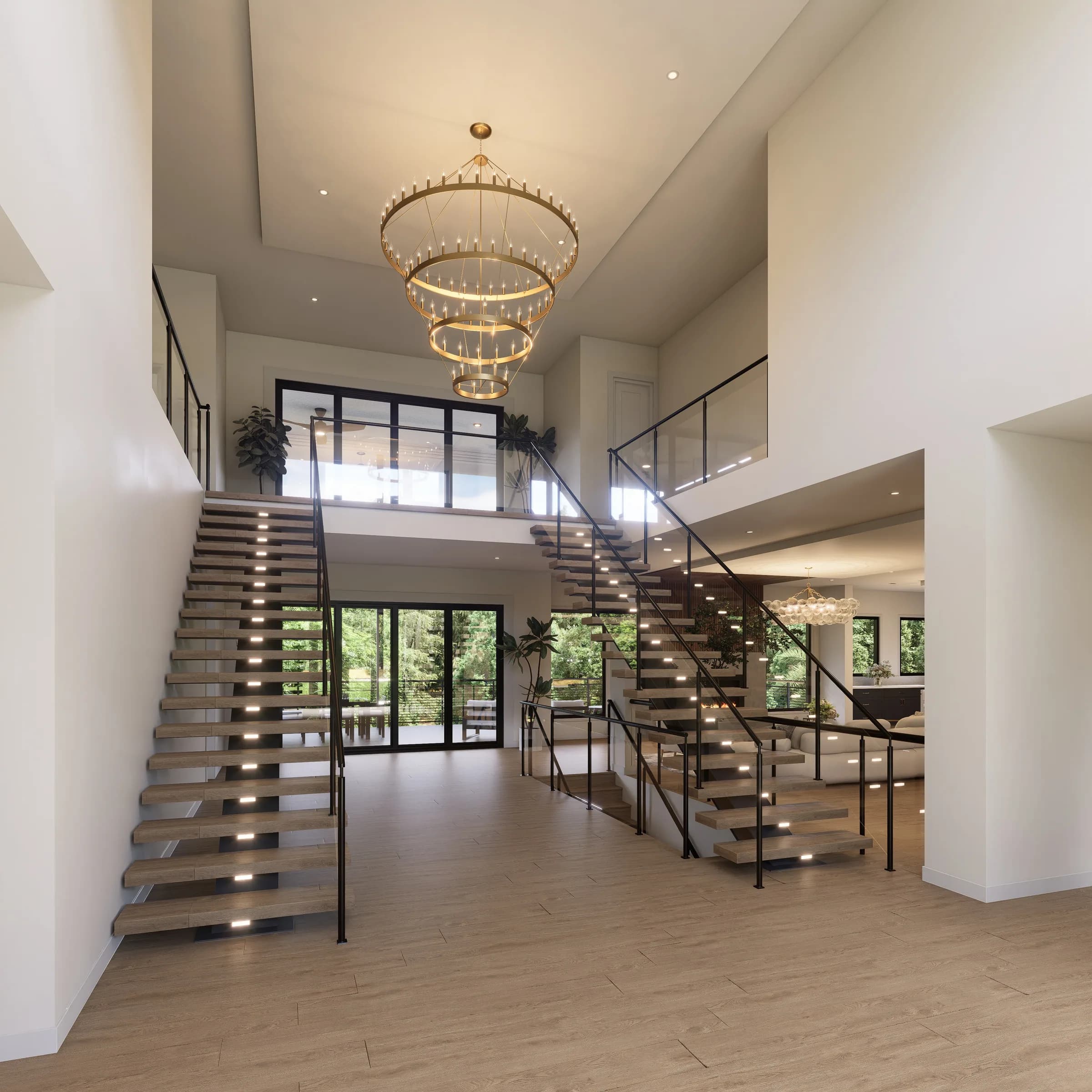 Double-height foyer with dual floating staircases and a brass ring chandelier